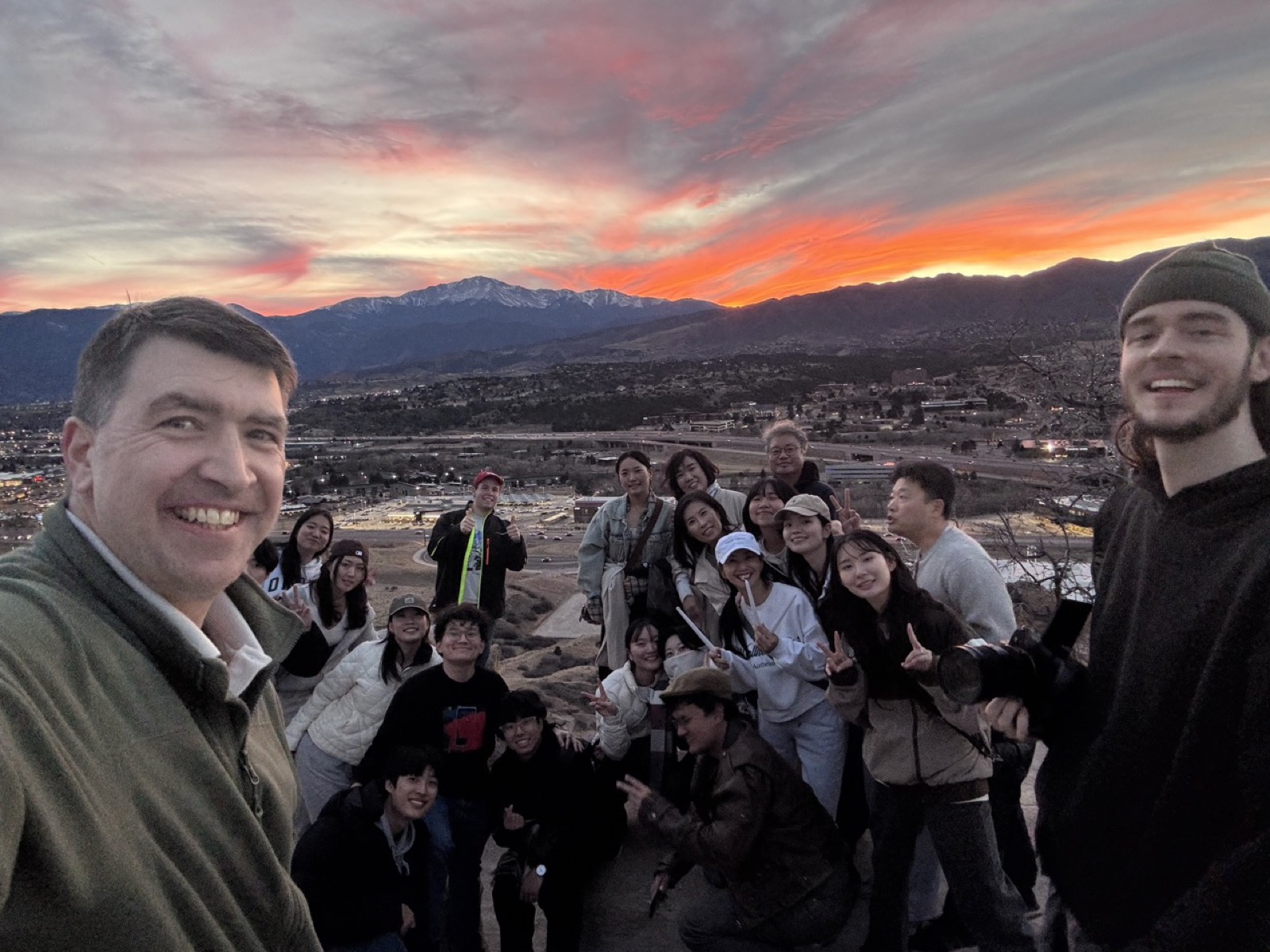 YWAM Château team at sunset overlooking Colorado Springs